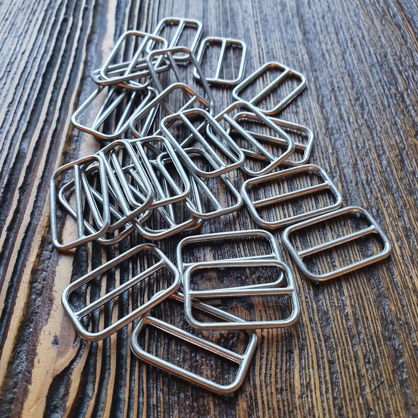 Schuifgespje. Binnenmaat 25mm. Zilver & Mat zilver. Verpakt per 50st.