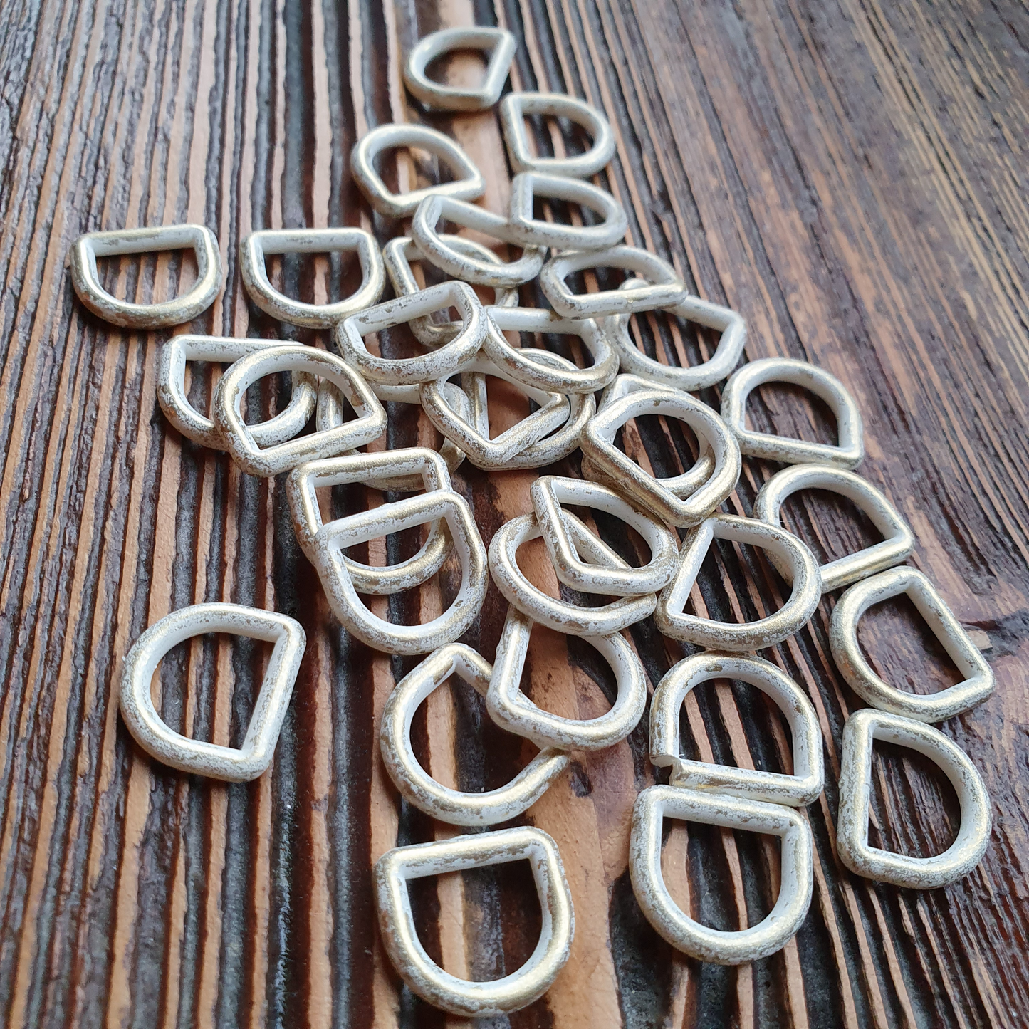 D-ring nylon10mm goud / white wash. Verpakt per 100 stuks.