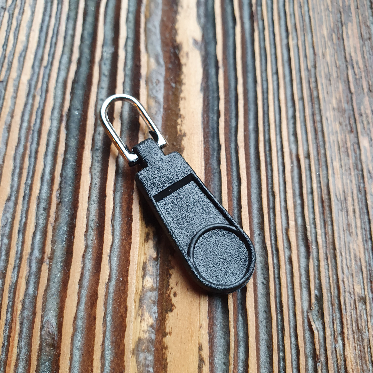 Ritsentrekker zwart / zilver. Verpakt per 100 stuks.